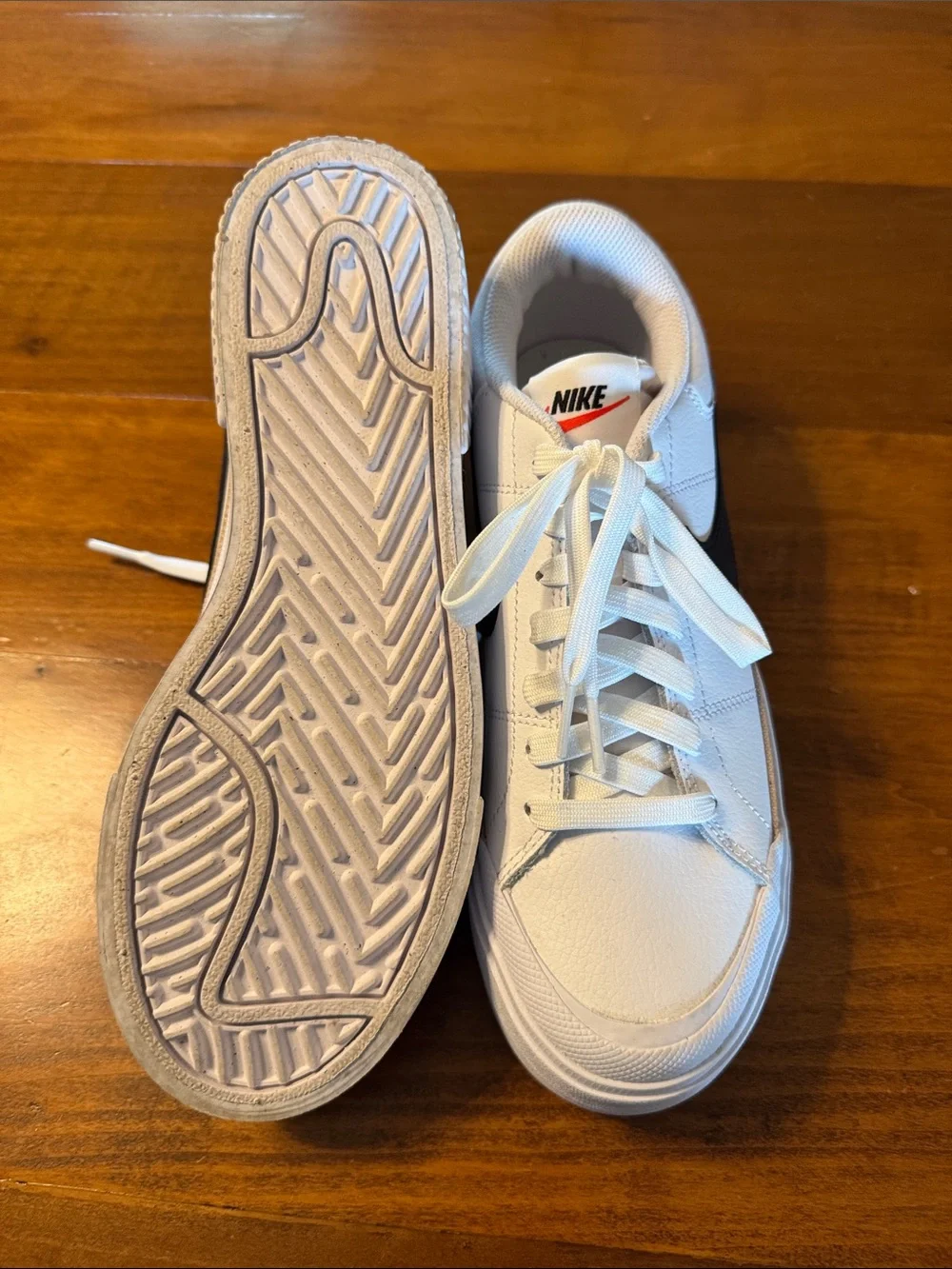 Nike Women’s White Sneakers with Black Swoosh and Tan Stripe